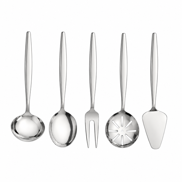 A 5-piece stainless steel serving utensil set arranged on a beige tablecloth with a salad bowl, plates, and dining props around it. The set includes a serving spoon, a serving fork, a decorative serving spoon, a cake server, and a dinner fork.