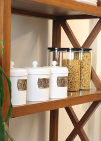 A set of three white cylindrical canisters with lids, each labeled with different names: Tea, Coffee, and Sugar.