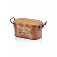 An oval-shaped copper bread bin with a wooden lid and dark metal side handles, featuring a brass plate engraved with the word 'BREAD'.