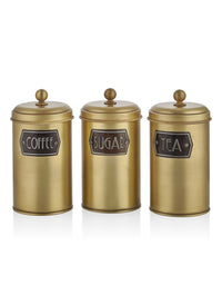 A set of three cylindrical gold-colored canisters with lids, labeled 'Coffee', 'Sugar', and 'Tea' respectively