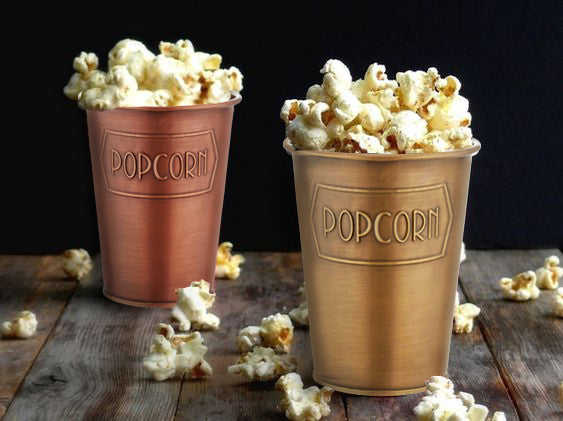 A gold galvanised steel popcorn bowl with the word 'POPCORN' embossed on the side.