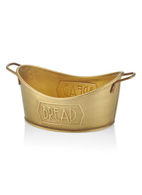 A gold-colored metal bread basket with 'BREAD' embossed on the side, featuring a rustic design with two handles.